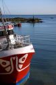 Fishing boat in the harbor at the village of Barfleur in the region of Basse-Normandie, France.