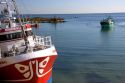 Fishing boats in the harbor at the village of Barfleur in the region of Basse-Normandie, France.