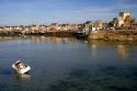 Low tide in the harbor at the village of Barfleur in the region of Basse-Normandie, France.