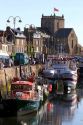 Fishing boats docked in the harbor at the village of Barfleur in the region of Basse-Normandie, France.