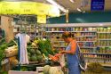 French woman shops for vegetables at a super market in the village of Barfleur in the region of Basse-Normandie, France.