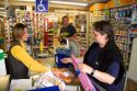 French woman paying for her groceries at a super market in the village of Barfleur in the region of Basse-Normandie, France.