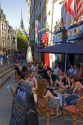 People dine outdoors at a cafe in Paris, France.