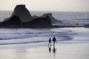 People walk on Ruby Beach at Olympic National Park, Washington.