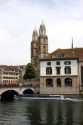 Tour boat passes beneath Munster Bridge crossing the Limmat River in Zurich, Switzerland with towers of Grossmunster church in background.

switzerland, swiss, europe, european, travel, tourism, swiss alps, alps, alpine, zurich,  limmat river, grossmunster, church, boat, tour boat, munster bridge