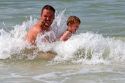 Father and son play in the water at St. Petersburg, Florida. MR