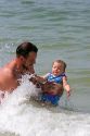 Father and infant daughter play in the water at St. Petersburg, Florida. MR