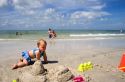Infant child crawling on the beach at St. Petersburg, Florida. MR