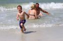 A family plays on the beach in St. Petersburg, Florida. MR