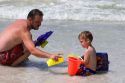 Father and son play on the beach at St. Petersburg, Florida. MR
