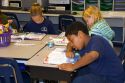 Fourth grade students read textbooks in a classroom at a public school in Tampa, Florida.