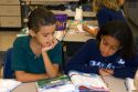 Fourth grade students read textbooks in a classroom at a public school in Tampa, Florida.