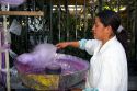 Mexican street vendor making cotton candy in Chapultepec Park in Mexico City, Mexico.