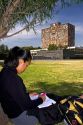 Female student studying near the Central Library on the campus of the National Autonomous University of Mexico in Mexico City, Mexico. MR