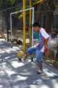 Teenage boy kicking a soccer ball in the La Boca barrio of Buenos Aires, Argentina.