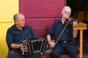 Argentine men playing the accordion and violin on the street in the La Boca barrio of Buenos Aires, Argentina.