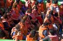 Passengers on a tour boat wearing life jackets in the Port at Valparaiso, Chile.