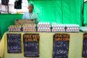 Man selling eggs at an outdoor produce market in Valparaiso, Chile.