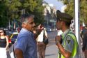 Chilean man speaking to a police officer in Santiago, Chile.