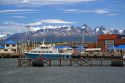 Boat docked at Ushuaia below the Martial mountain range on the island of Tierra del Fuego, Argentina.