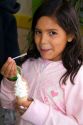 Girl eating an ice cream cone at Ushuaia on the island of Tierra del Fuego, Argentina.