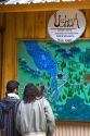 Tourists look at a map of the Tierra del Fuego National Park, Argentina.