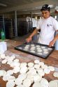 Baker making biscuits at the Panaderia Union in Tolhuin, Tierra del Fuego, Argentina.