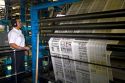 Newspaper being printed on a rotary printing press for the Houston Chronicle in Houston, Texas.