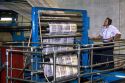 Pressman inspects newspapers being printed on a rotary printing press for the Houston Chronicle in Houston, Texas.