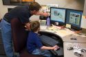 Father showing his son what he does at work for the Ada County Highway District on Take Our Daughters and Sons To Work Day in Boise, Idaho.
