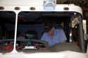 Worker installing wiring into a newly manufactured fire truck chassis at Spartan Motors in Charlotte, Michigan.