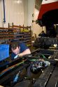 Worker manufacturing a truck chassis at Spartan Motors in Charlotte, Michigan.