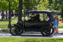 Visitors ride in a Ford Model T in Greenfield Village at The Henry Ford in Dearborn, Michigan.