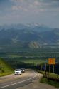 Vehicles travel over the high mountain Teton Pass on Wyoming Highway 22 near the state border of Idaho and Wyoming.