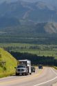 Vehicles travel over the high mountain Teton Pass on Wyoming Highway 22 near the state border of Wyoming and Idaho.
