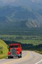 Dump truck traveling over the high mountain Teton Pass on Wyoming Highway 22 near the state border of Wyoming and Idaho.