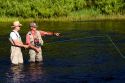 Guide and fly fisherman on the Lewis River in Yellowstone National Park, Wyoming.