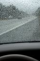 Raindrops on the windshield of a car in Washington.