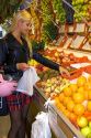 Spanish woman shopping at a Fruiteria in the city of Donostia-San Sebastian, Guipuzcoa, Basque Country, Northern Spain.
