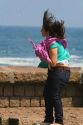 Air from a blowhole lifts a girls hair and clothing in the city of Donostia-San Sebastian, Guipuzcoa, Basque Country, Northern Spain.