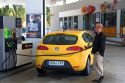 Customer filling his car with fuel at a gas station along the Autopista near Pamplona, Navarre, northern Spain.