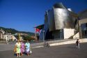 Visitors in front of the Guggenheim Museum in the city of Bilbao, Biscay, Basque Country, northern Spain.