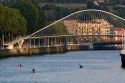 Kayakers on the Nervion River near the Zubizuri Footbridge in the city of Bilbao, Biscay, Basque Country, northern Spain.