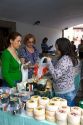 Customers purchase cheese from an outdoor market in the town of Cangas de Onis, Asturias, northern Spain.