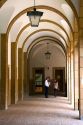 People talk under an arched portico on the campus of the University of Deusto in the city of Bilbao, Biscay, northern Spain.