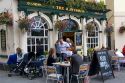 People dine outdoors at The Huntsman pub in Bath, Somerset, England.