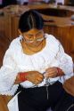 Indian woman making jewelry in the Indian Museum of North America at the Crazy Horse Memorial in the Black Hills of South Dakota.