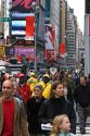 Pedestrians crossing the street in Times Square, Manhattan, New York City, New York, USA.
