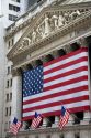 American flags in front of the New York Stock Exchange in New York City, New York, USA.