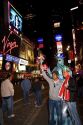 Tourists in Times Square at night in Manhattan, New York City, New York, USA.